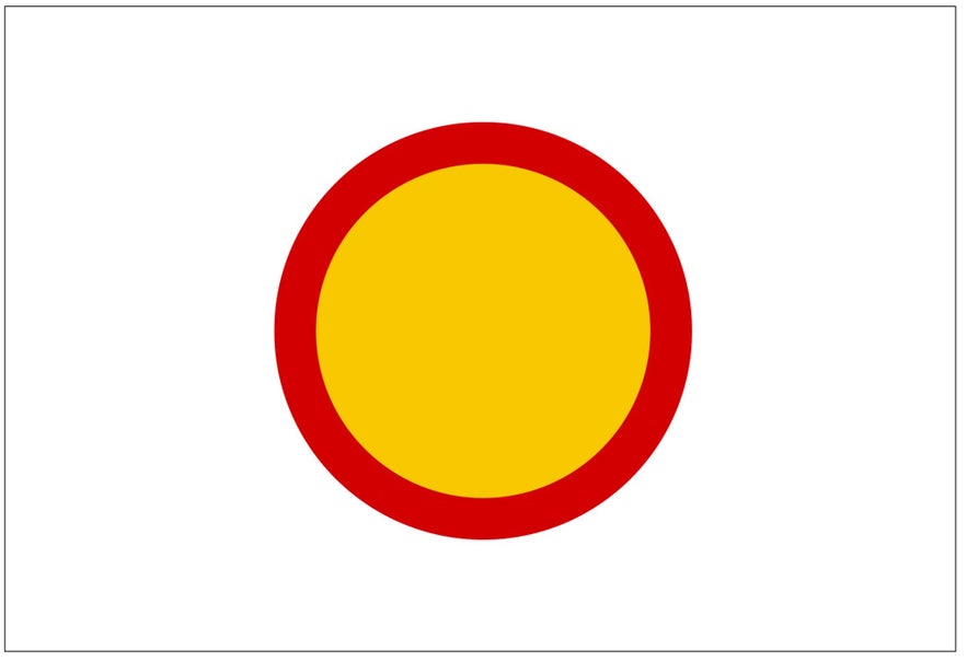 A yellow, circular Icelandic road sign with a red border indicates that the road is closed to all vehicles.