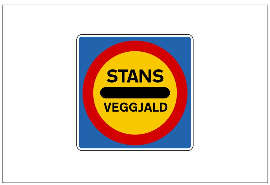 A yellow, red, and blue sign in Iceland with black writing and the word "STANS" informs drivers to stop.