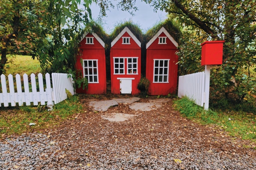 A miniature replica of a turf house is inside the Akureyri Christmas House grounds in North Iceland.