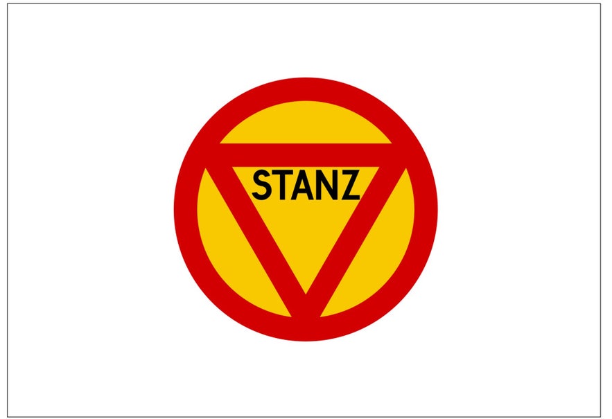 An outdated stop sign in Iceland with a yellow background, red border and triangle, and the word STANZ in the middle.