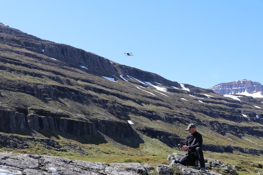 Drone pilot exploring Seydisfjordur in East Iceland while flying drones in Iceland’s dramatic highlands.