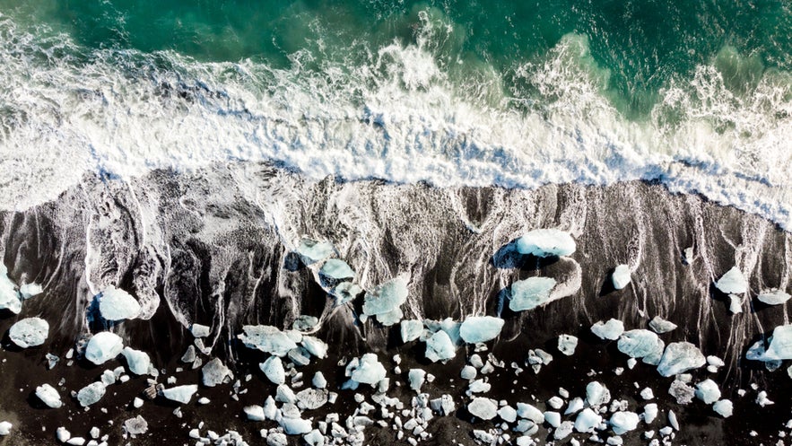 Capturing drifting ice chunks along the shoreline at Diamond Beach while flying drones in Iceland.