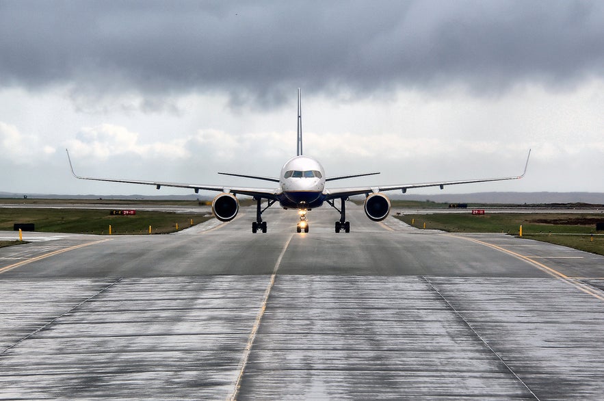 Passenger plane on the runway at Keflavik Airport, the main gateway for air transportation in Iceland.