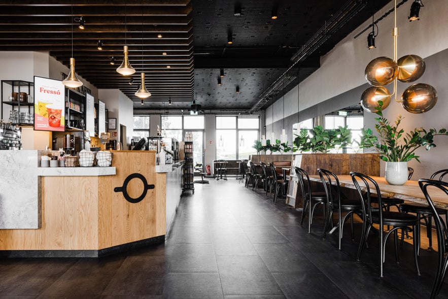 Modern interior of Te & Kaffi café in Reykjavik with stylish seating and coffee bar.