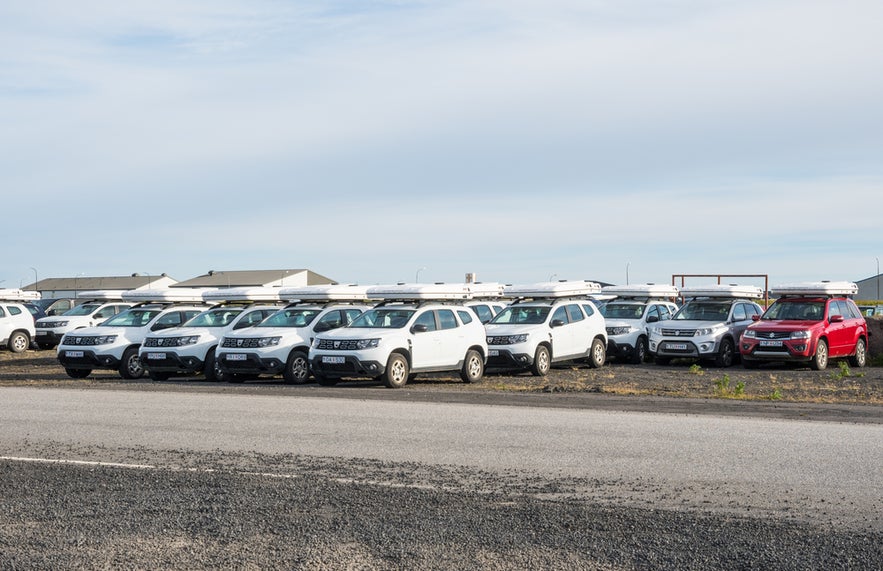 Rental cars parked near Keflavik Airport, ideal for driving in Iceland and starting self-drive tours.