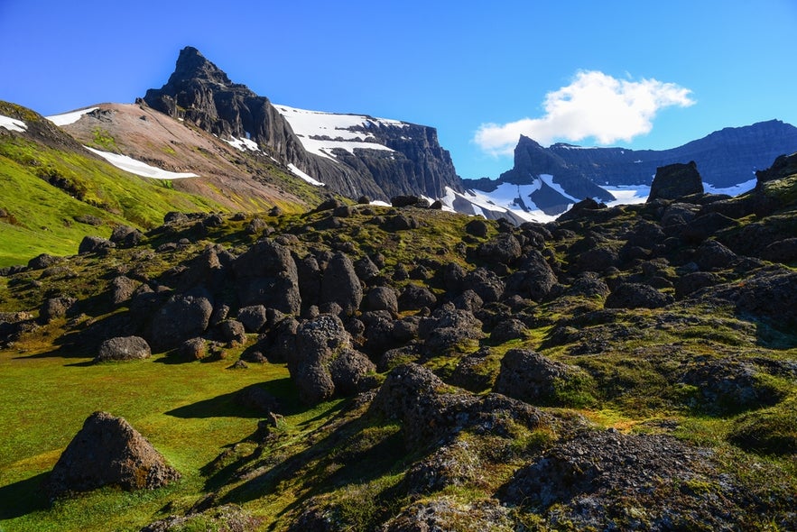 The best places to visit in East Iceland include Storurd beneath Mt. Dyrfjoll, a top hiking spot with alpine scenery.