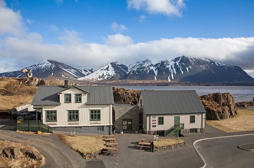 The Settlement Center Restaurant with mountain views and ocean backdrop in Borganes, Iceland.