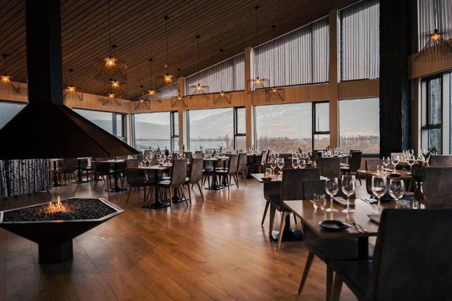Interior view of Husafell Restaurant, a top dining spot in Iceland, featuring elegant decor and a cozy atmosphere.