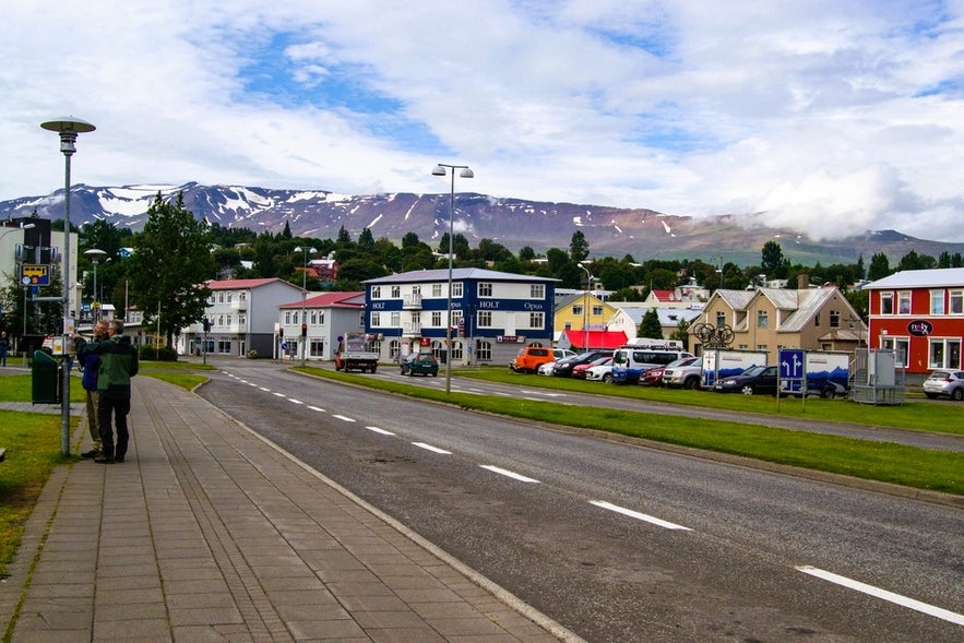 Street view of Akureyri with cars parked, showing options for parking outside Reykjavik in Iceland.