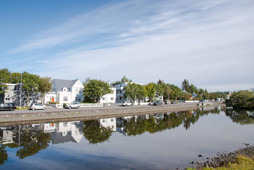 Scenic waterfront houses in Hafnarfjordur, Iceland, a charming town popular for visitors seeking places to stay in Iceland.