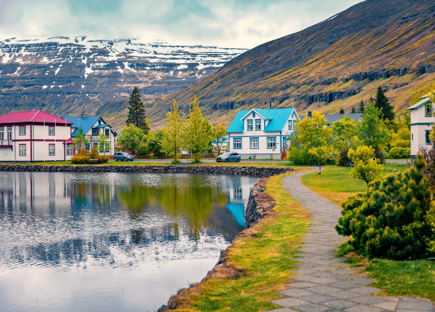 Colorful houses by the water in Seydisfjordur, East Iceland, a scenic village known for unique charm and places to stay in Iceland.