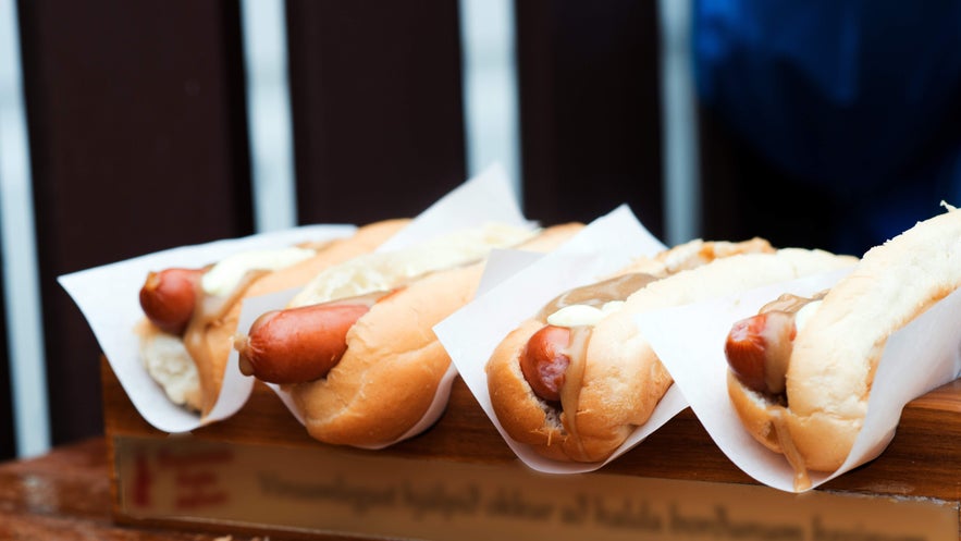 Close-up of Icelandic hot dogs served fresh with toppings in Reykjavik. 
