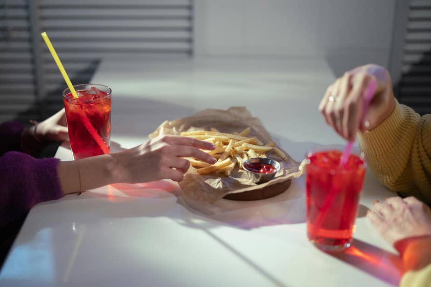 Table with fries and drinks at one of the affordable restaurants in Reykjavik.