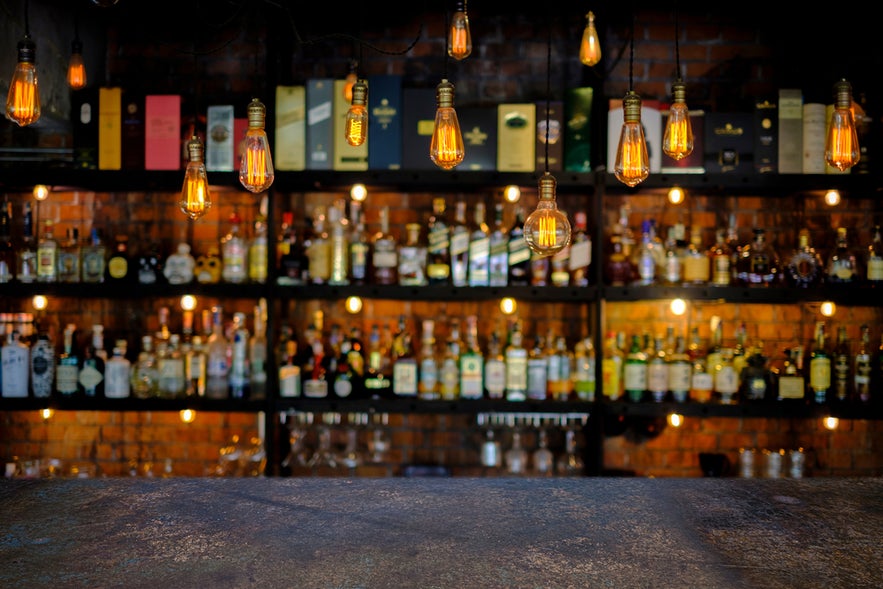 Steel table with soft focus Icelandic liquor bar background.