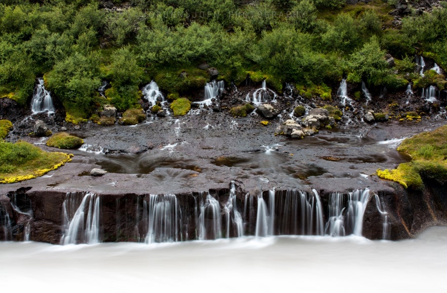 The cascades of Hraunfossar waterfalls