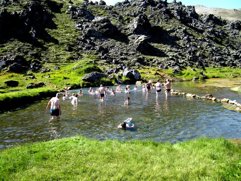 Bathing in geothermal water in Landmannalaugar Bathing in geothermal water in Landmannalaugar
