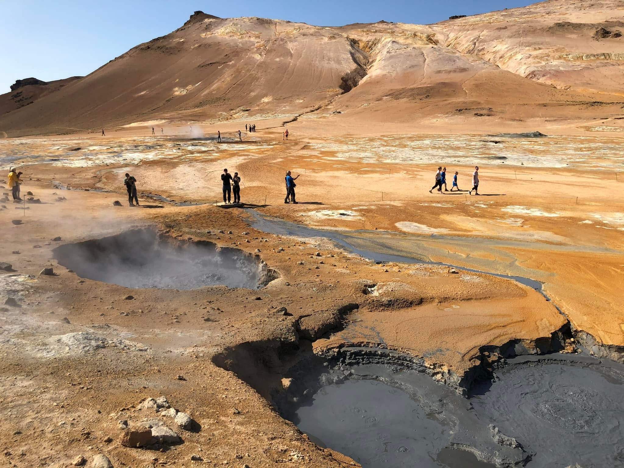 Steaming geothermal mud pools and hot springs at Hverir Geothermal Area near Lake Myvatn.