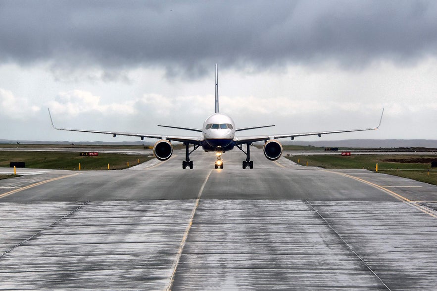 Plane on the runway at Keflavik Airport in Iceland.
