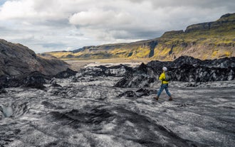 Parts of Solheimajokull Glacier's terrain are covered in black ash.