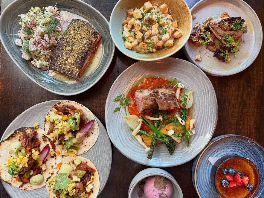 Colorful spread of dishes at Hosilo Restaurant in Reykjavik.