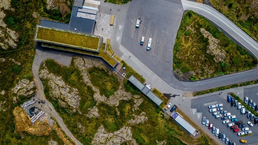 Aerial view of Thingvellir National Park Visitor Center in Iceland with parking lot and walking paths.