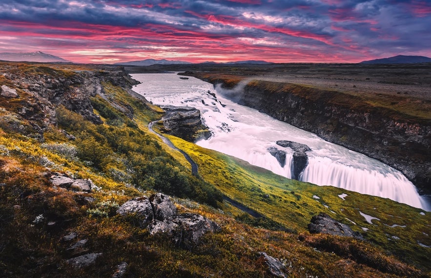 Gullfoss Waterfall on the Golden Circle near Thingvellir National Park in Iceland with dramatic canyon and sunset sky.