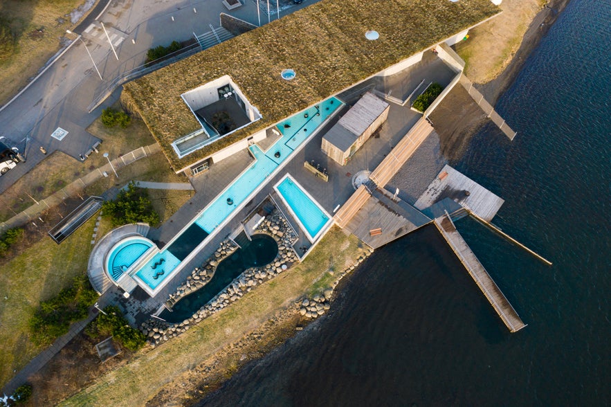 Aerial view of Laugarvatn Fontana Spa near Thingvellir National Park in Iceland with geothermal pools and lake access.