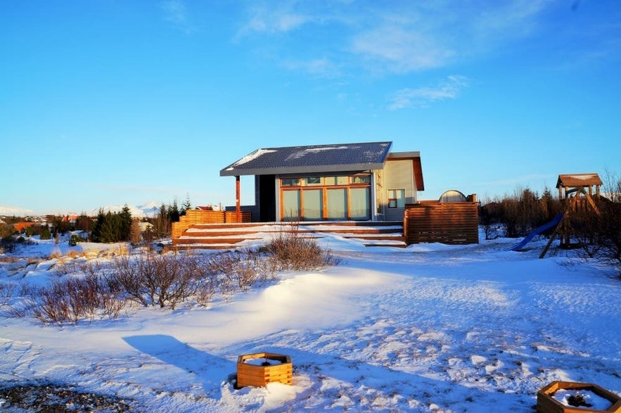 Lundur Cottage near Thingvellir National Park in Iceland, a modern holiday rental with winter snow views.
