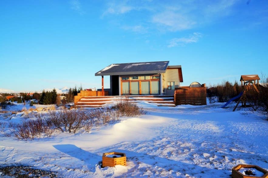 Lundur Cottage near Thingvellir National Park in Iceland, a modern holiday rental with winter snow views.
