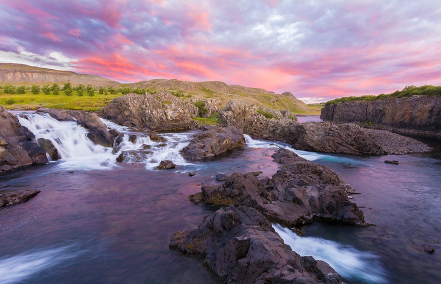 Glanni Waterfall at sunset in West Iceland, a scenic stop along the Silver Circle tours.