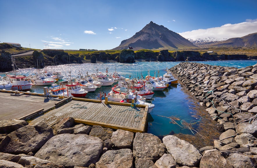Fishing boats in Arnarstapi harbor, Snaefellsnes Peninsula, West Iceland in summer.