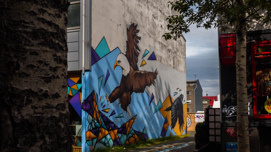 Mural of an eagle on the side wall of a building in Reykjavik, highlighting the city’s vibrant street art scene for October explorers.