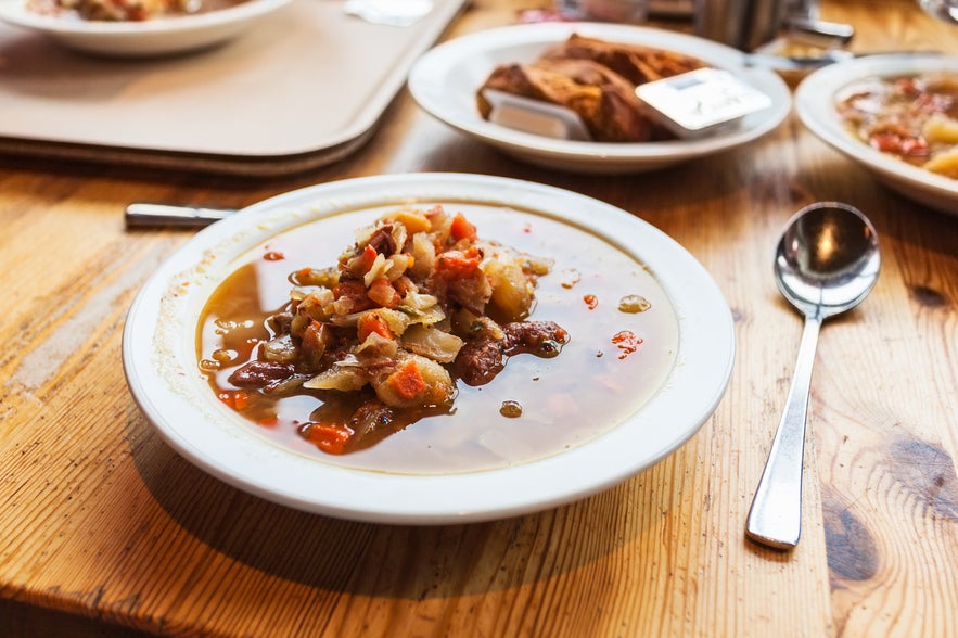 Icelandic lamb soup served in a bowl on a table in Reykjavik, a seasonal dish to enjoy while visiting the city in October.