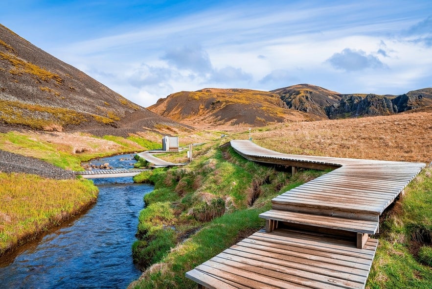 Hiking in Reykjadalur Valley to reach its hot spring river is one of the most unique outdoor things to do near Selfoss.