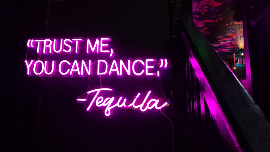 Neon sign at Kiki Bar in Reykjavik reading &ldquo;Trust me, you can dance &ndash; Tequila.&rdquo;