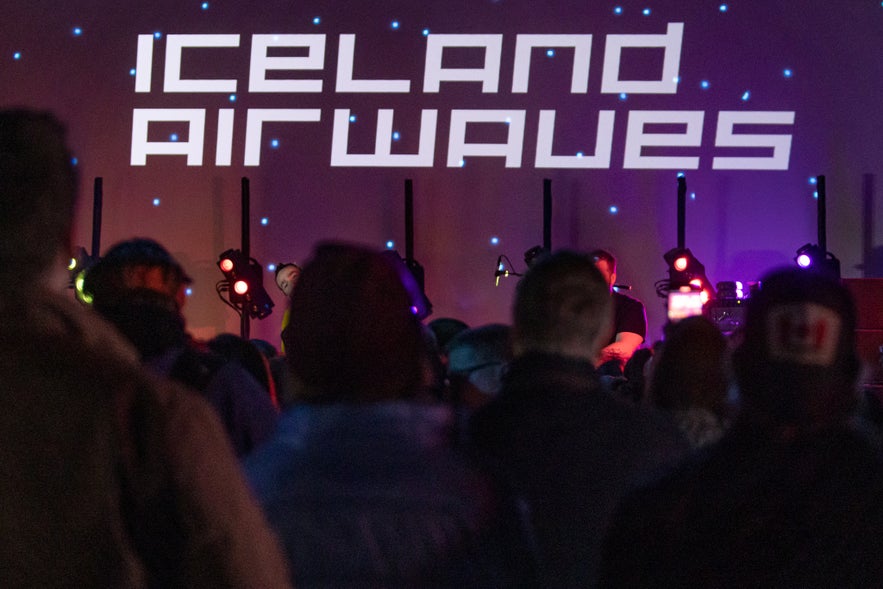 Crowd attending Iceland Airwaves music festival in Reykjavik, Iceland, with live performances and stage lights.