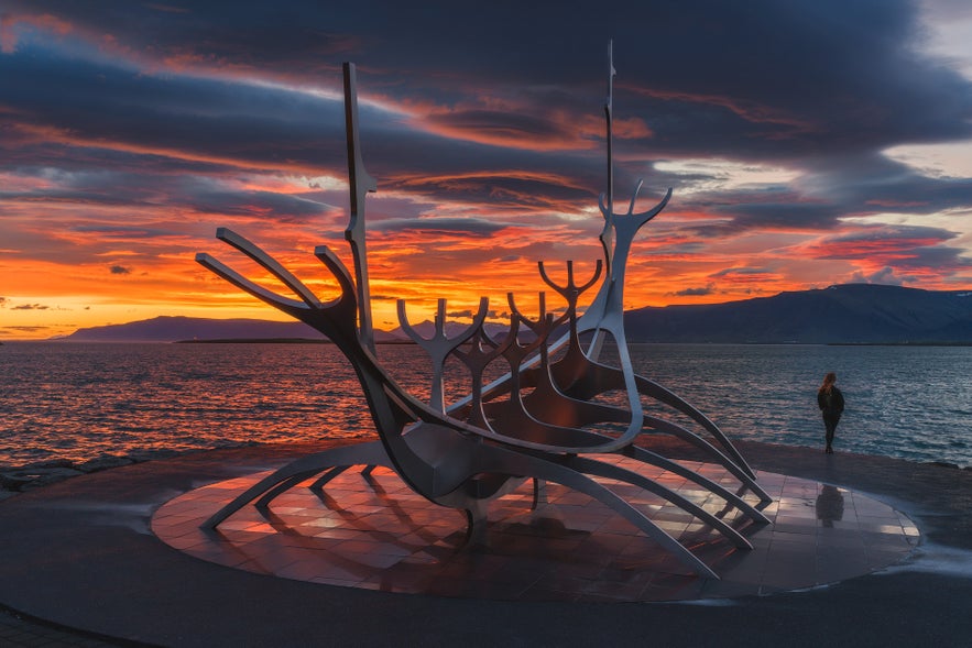 Sun Voyager sculpture by the sea in Reykjavik at sunset during the midnight sun.