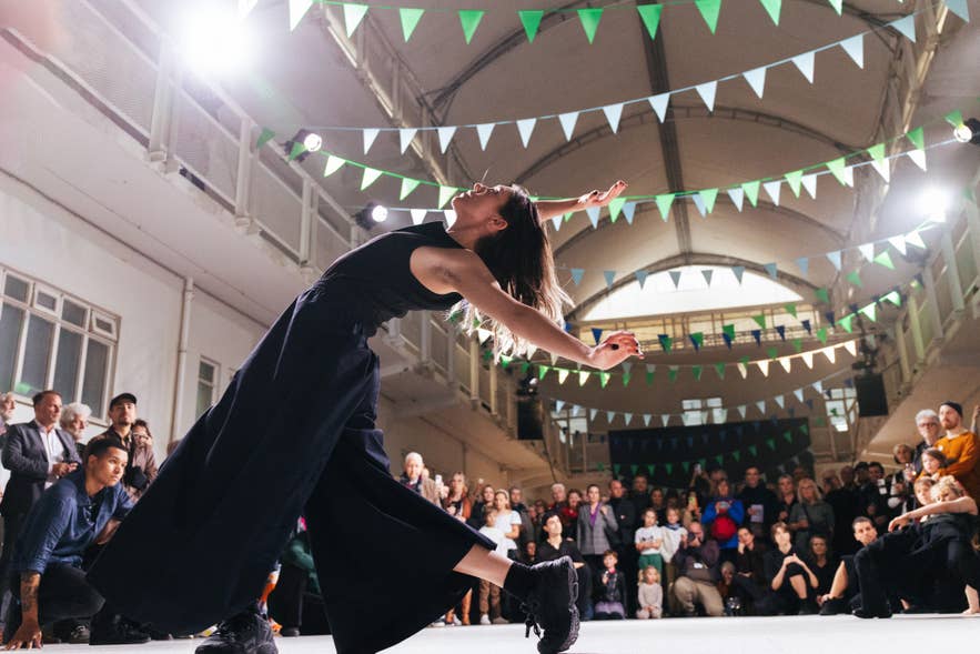 Contemporary dance performance in an indoor venue with an audience watching at the Reykjavik Arts Festival.
