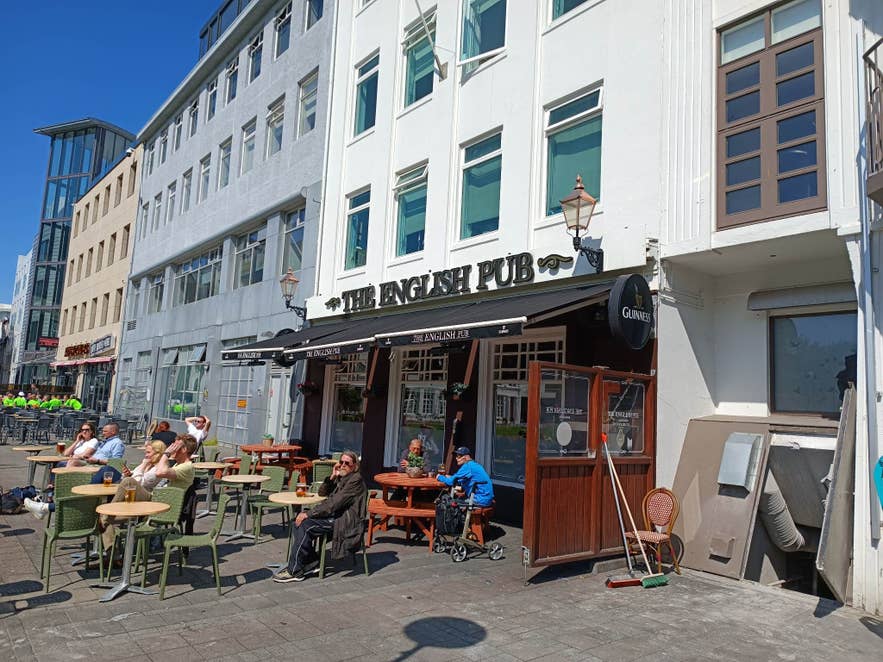 Guests enjoying drinks at The English Pub on Laugavegur Street.