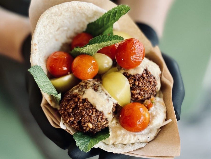 Flat bread with falafel and hummus at Chickpea in Reykjavik offering vegan or vegetarian food in Iceland. 