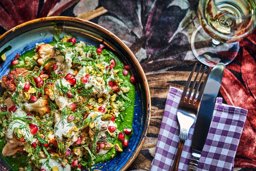 Vegetarian and vegan food served with green sauce at Fjallkonan restaurant in Reykjavik.