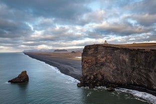 Witness the breathtaking views from Dyrholaey, where the rugged cliffs meet the crashing waves of the North Atlantic Ocean.