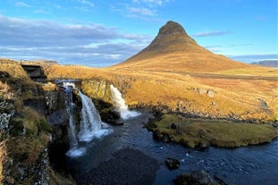 Mount Kirkjufell and Kirkjufellsfoss waterfall look beautiful during summer.