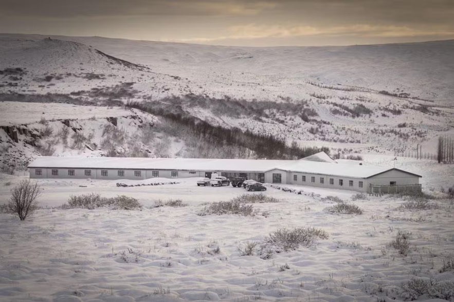 ION Adventure Hotel in winter near Thingvellir National Park, Iceland, surrounded by snow-covered volcanic hills.