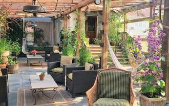Garden-style outdoor seating area at The Old Schoolhouse - Gaulverjaskoli guesthouse in Iceland.