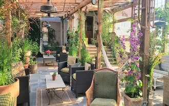 Garden-style outdoor seating area at The Old Schoolhouse - Gaulverjaskoli guesthouse in Iceland.