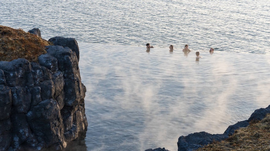 People at the sky lagoon, showcasing the beautiful infinity pool edge