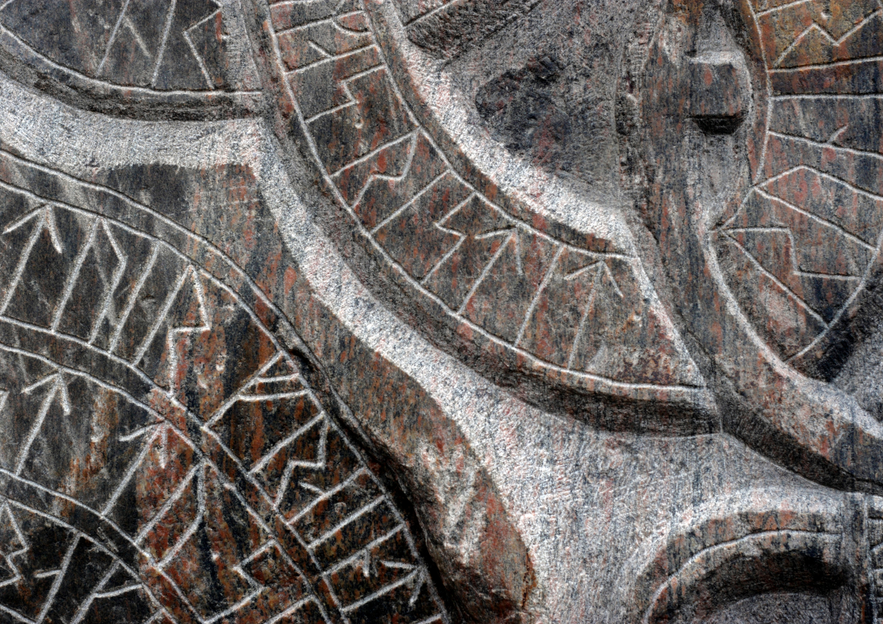 Close-up of ancient Icelandic runes carved into stone