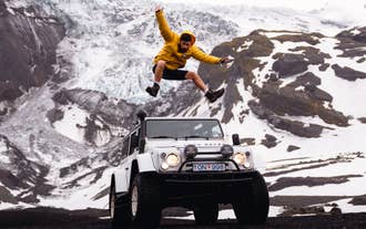 Super Jeep crossing snowy terrain on the Thorsmork hike adventure.