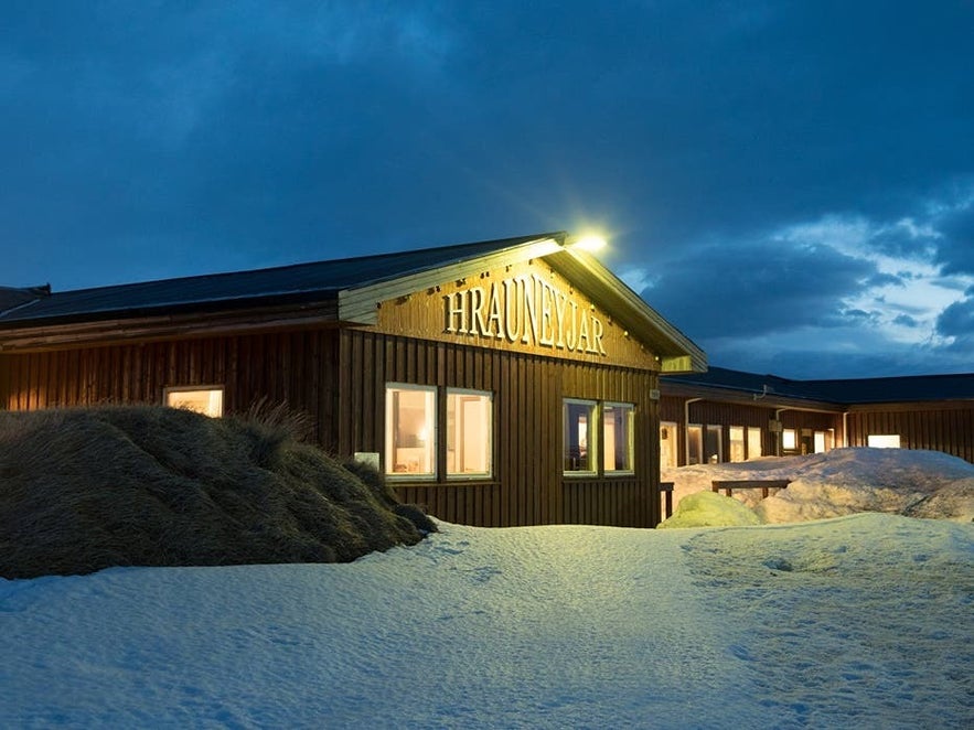 Hrauneyjar Highland Center near Landmannalaugar, Iceland, surrounded by snow under evening light.